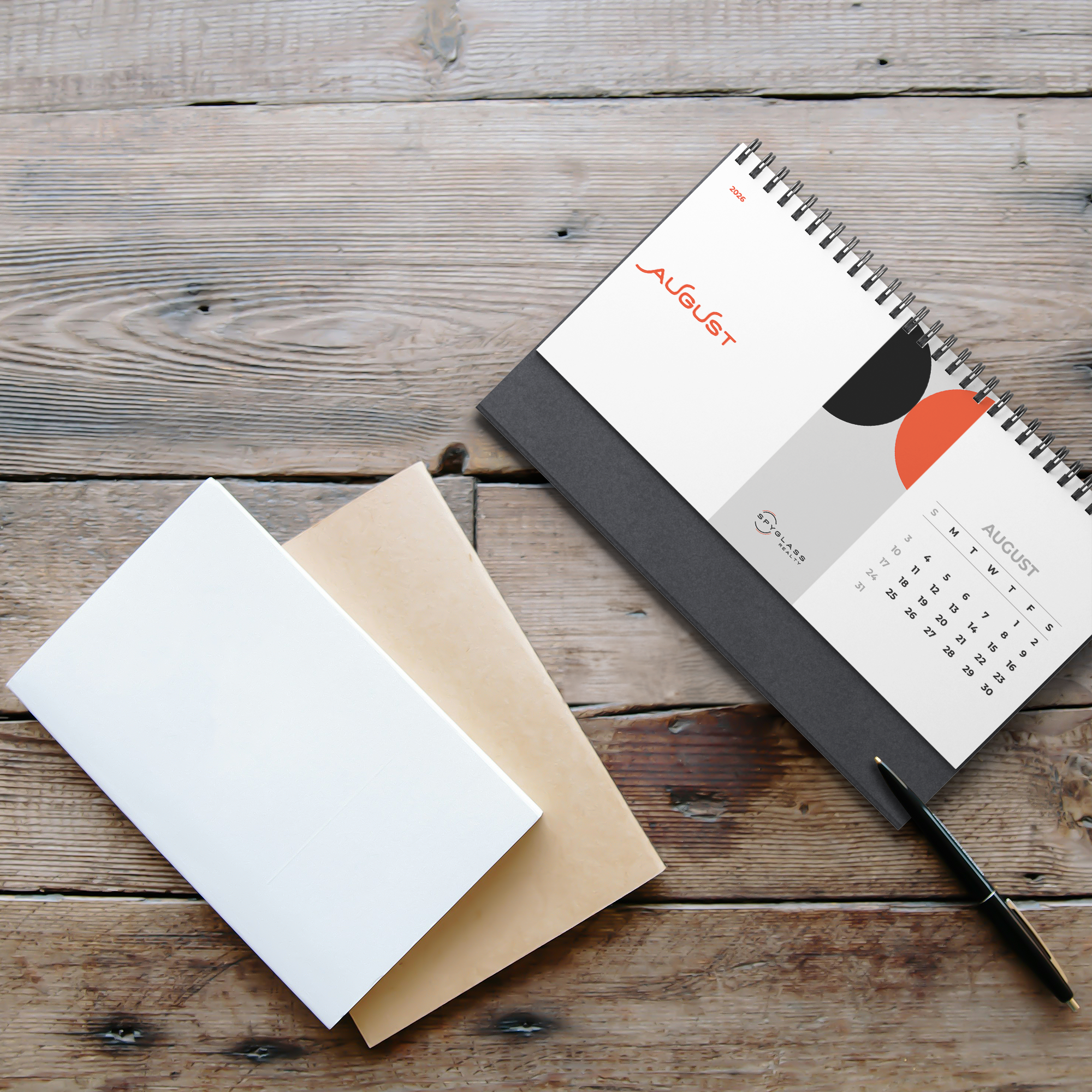 2026_Spyglass_Realty_Desk_Calendar_Wooden_Table_Mockup.png